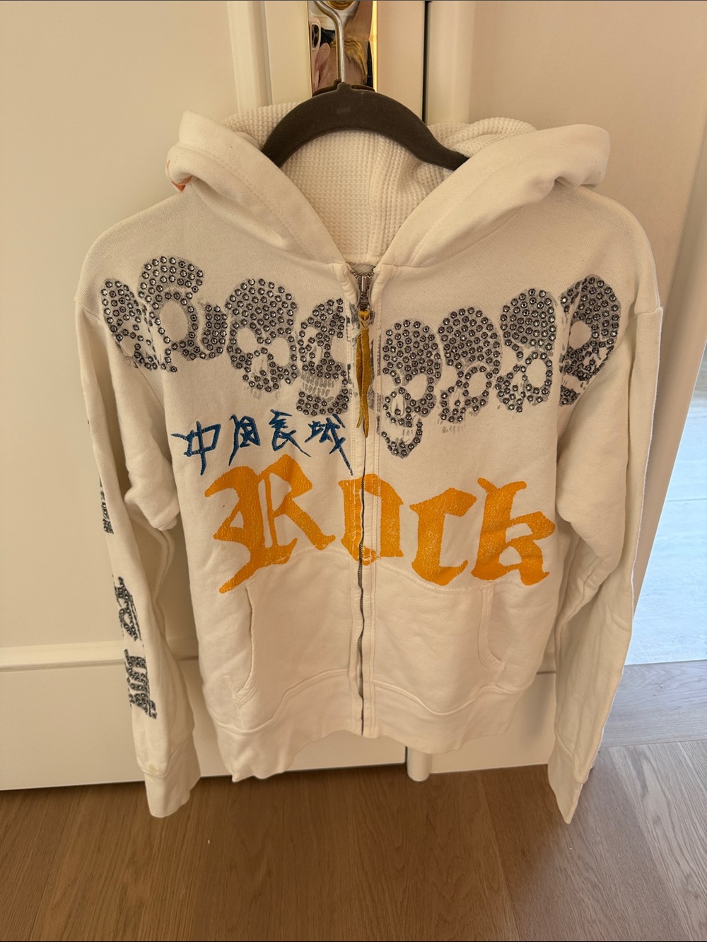 The Great China Wall Cream Zip Hoodie with Yellow Script and Black Embellishment
